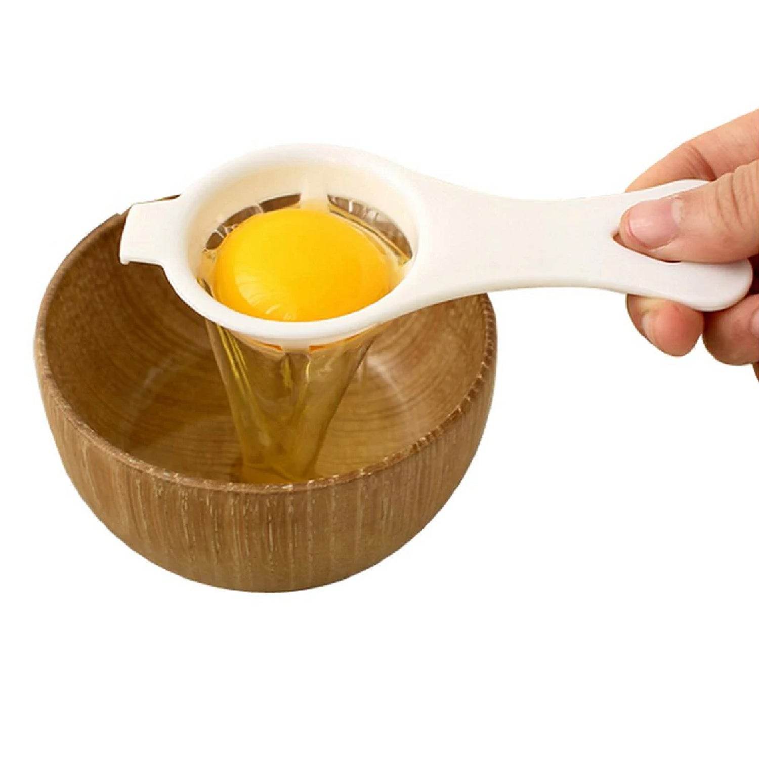 Bachat Club egg yolk separator tool in white plastic separating yolk over wooden bowl