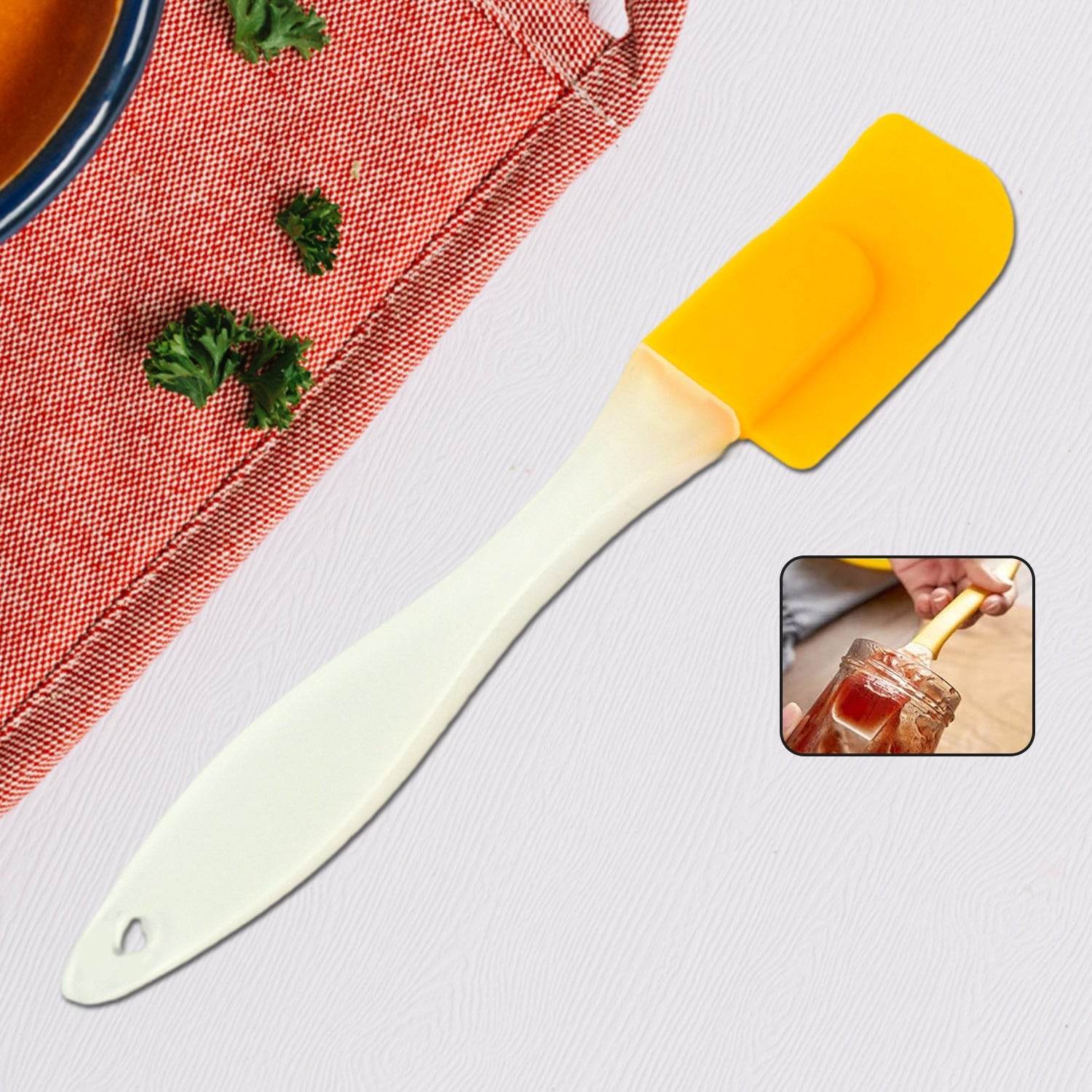 Bachat Club yellow silicone cooking spatula with white handle for mixing and scraping in kitchen