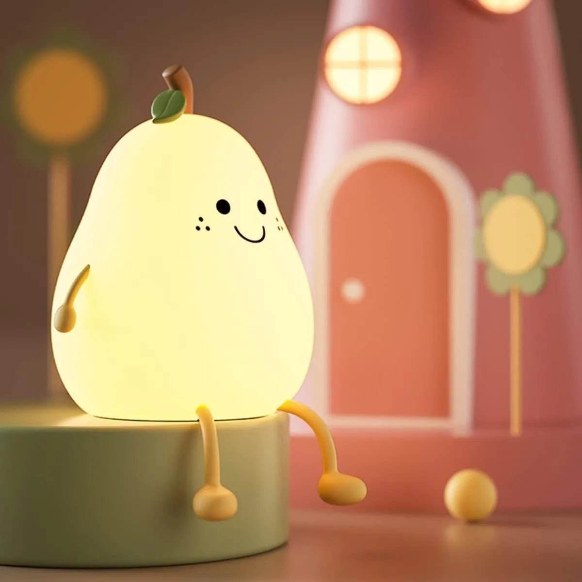 Cute pear-shaped kids silicone night light with smiling face and dangling legs on a round platform