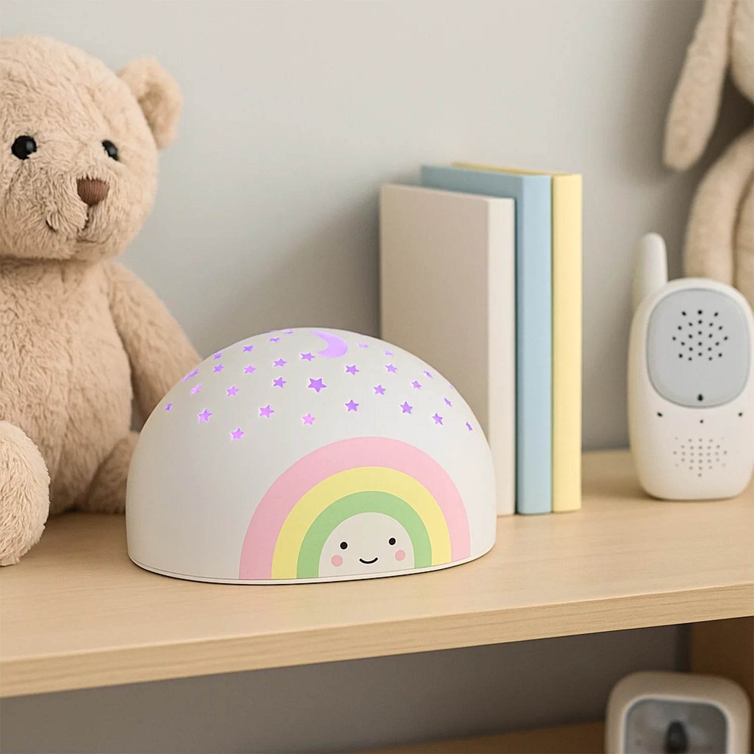 Bachat Club LED rainbow projector night light with cute rainbow design and star patterns on wooden shelf