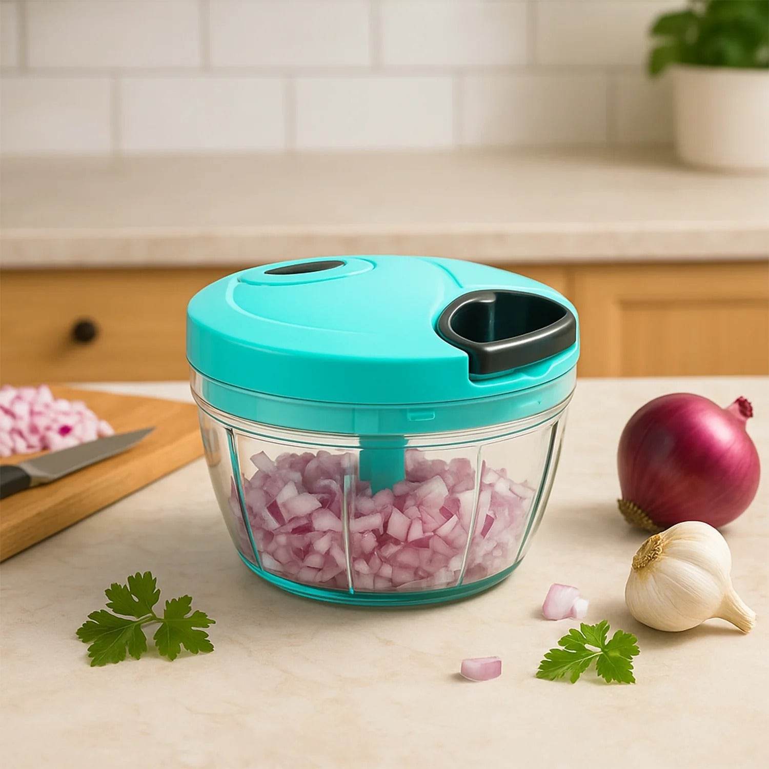 Bachat Club smart mini chopper with turquoise lid chopping onions on kitchen counter