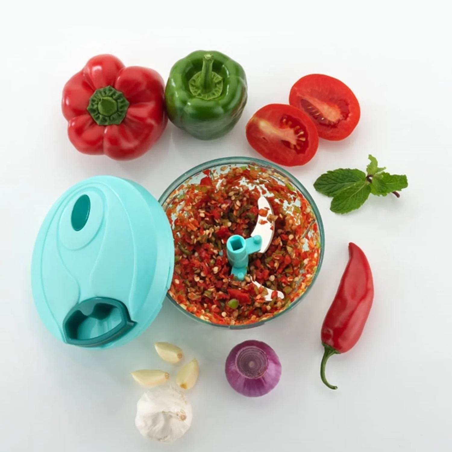 Bachat Club smart mini chopper with chopped vegetables and fresh ingredients around it